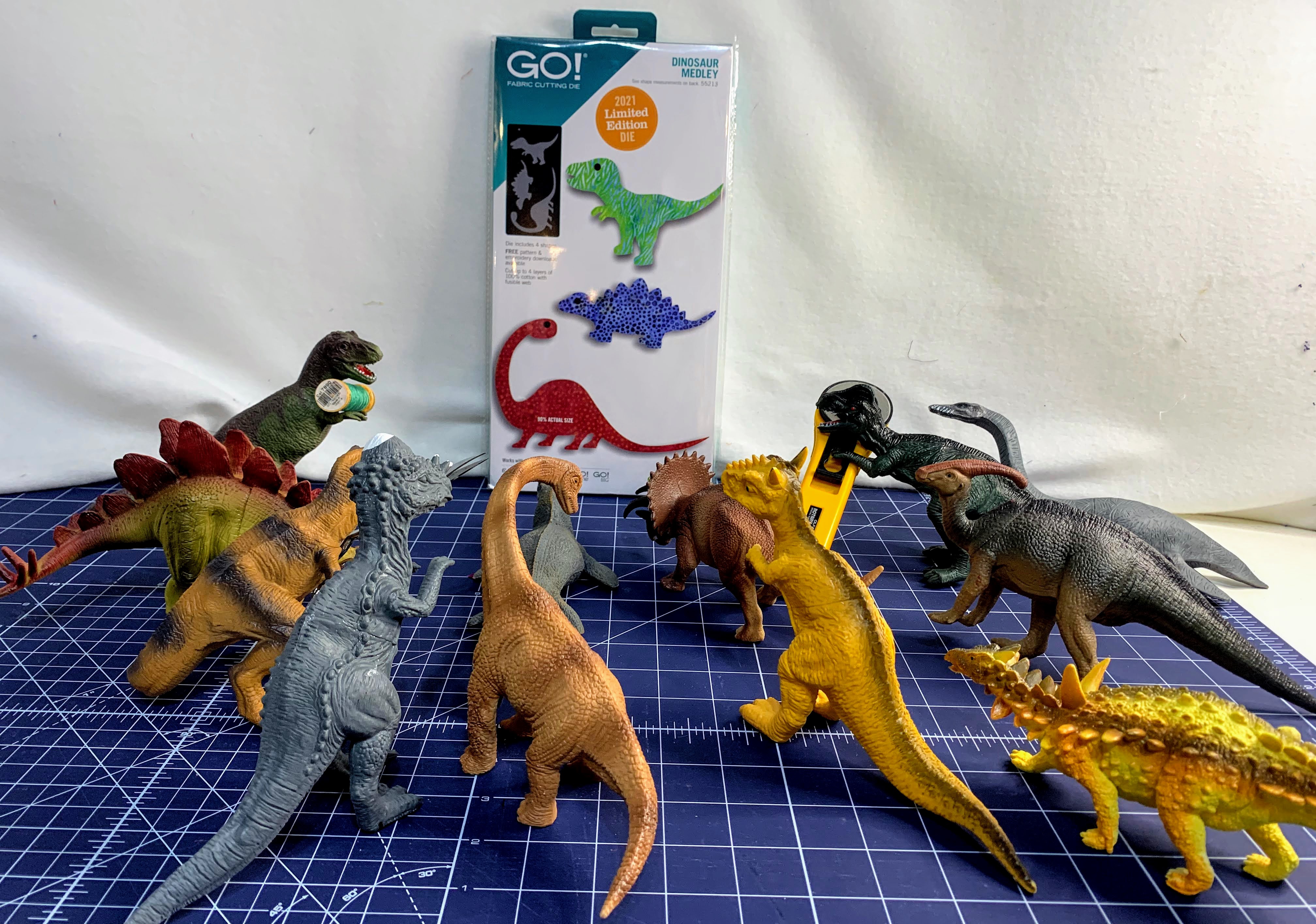Dinosaurs gather round the new die, dreaming of their own play mat world. 